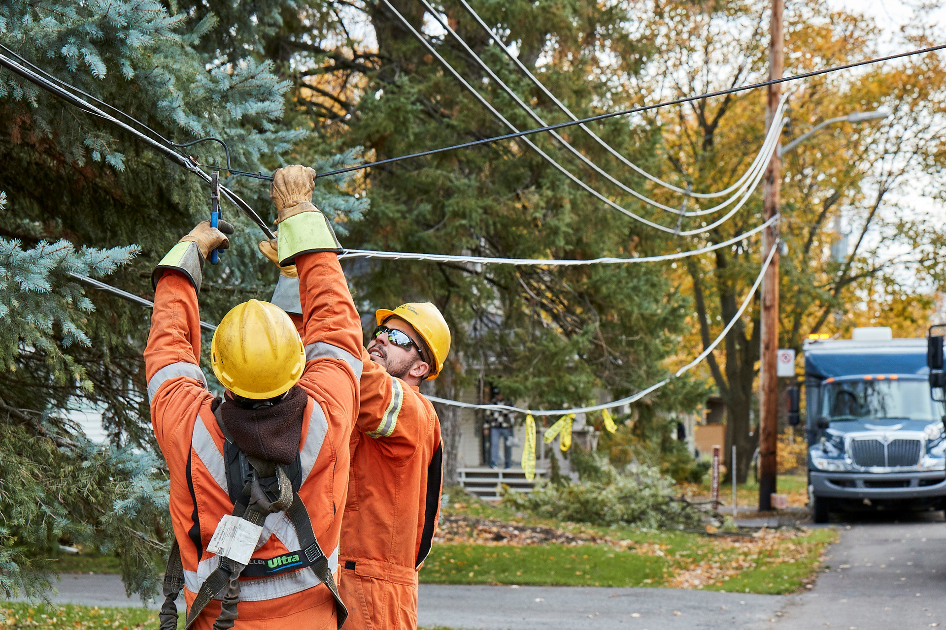 Utility workers restoring service after windstorm