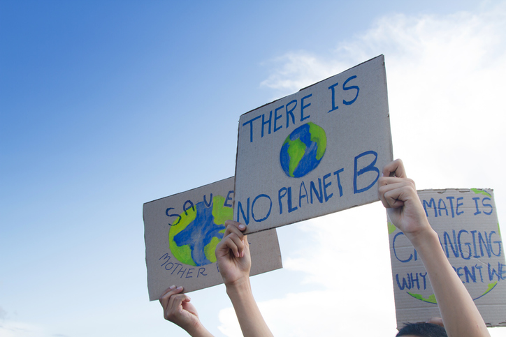 Placards with messages to save the environment written on them