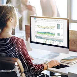 A woman working with data on a computer A woman working with data on a computer
