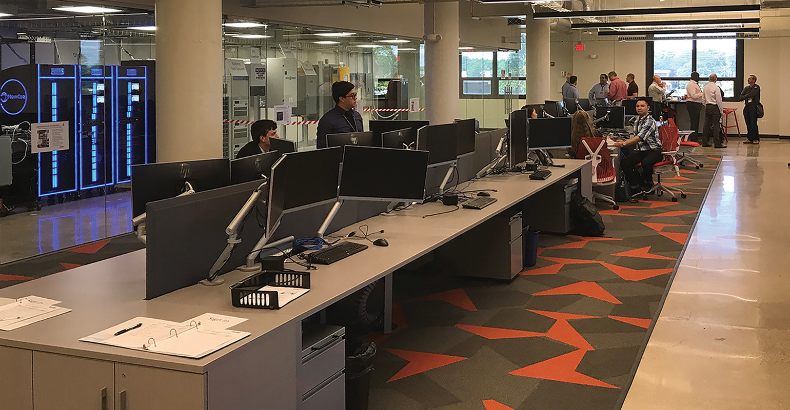 ComEd engineers and executives in the lab