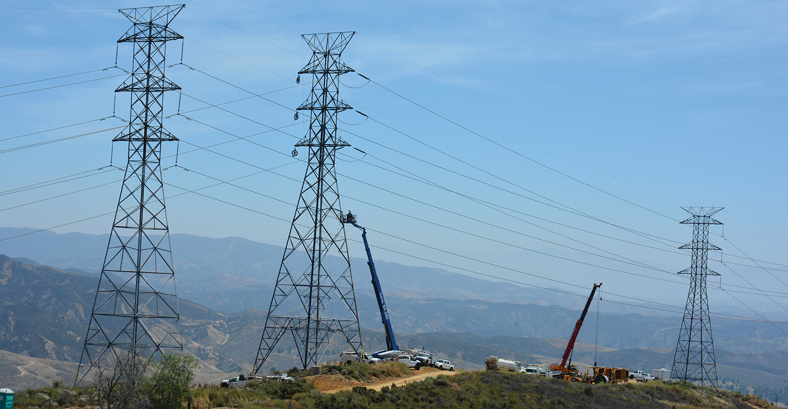 Electric transmission towers and overhead lines