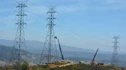 Electric transmission towers and overhead lines