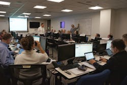 People working on computers in office People working on computers in office