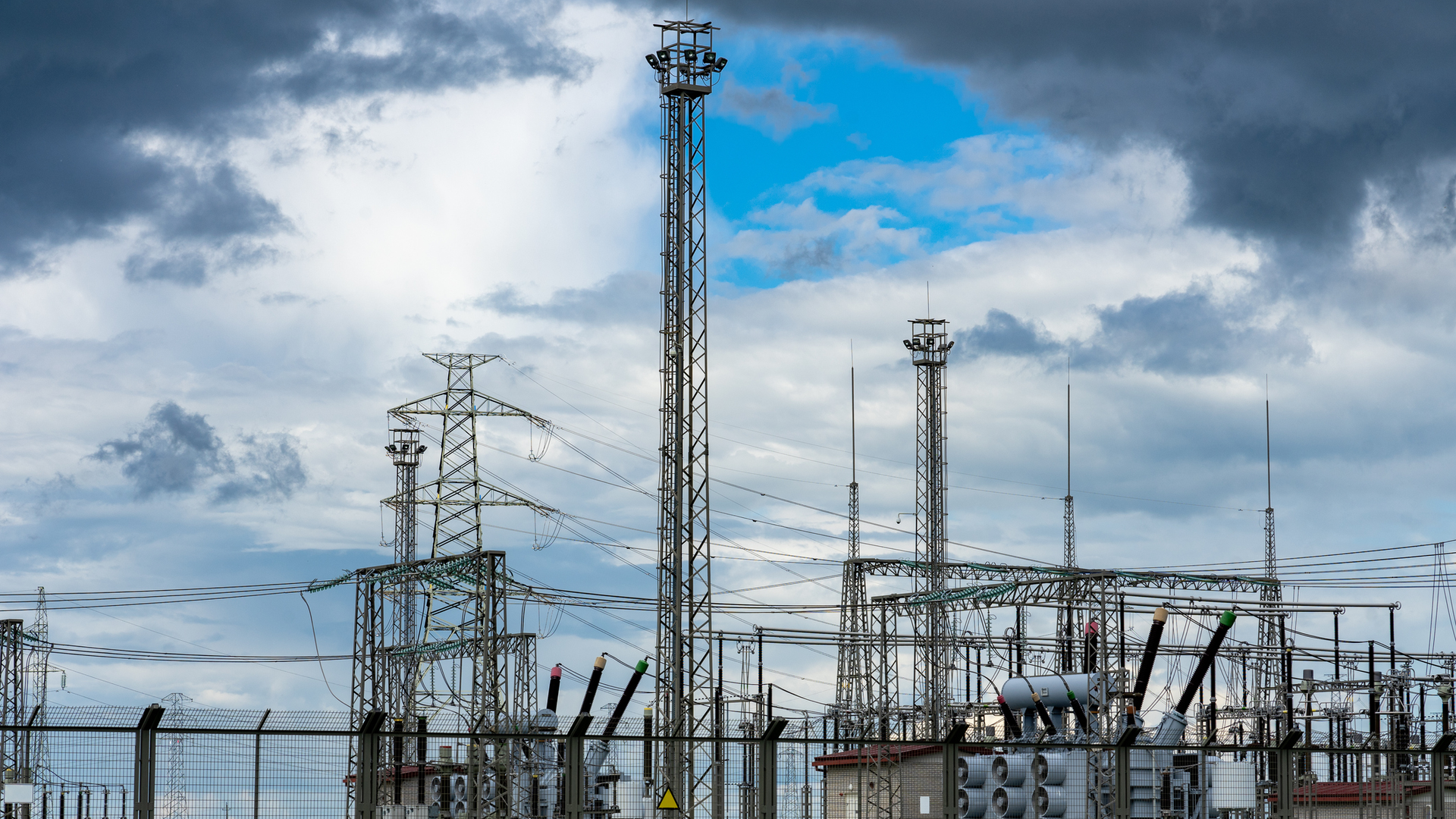 Electric transmission towers and overhead lines
