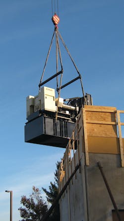 Lifting one of two backup generators into the generator building. Lifting one of two backup generators into the generator building.