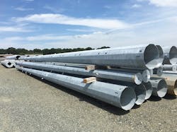 Steel poles in the storage yard. Steel poles in the storage yard.
