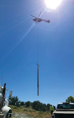 Blackhawk helicopter in action setting poles. Blackhawk helicopter in action setting poles.