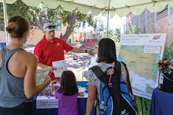 SDG&E representative meeting with community members at the SDG&E Wildfire Safety Fair. SDG&E representative meeting with community members at the SDG&E Wildfire Safety Fair.