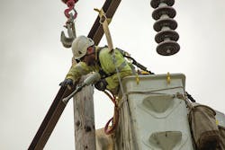 BPA line crews work to replace transmission components on a line north of Salem, Oregon.