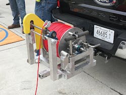 Service Electric Co.'s patented tensioner for rope pulling operations. Service Electric Co.'s patented tensioner for rope pulling operations.