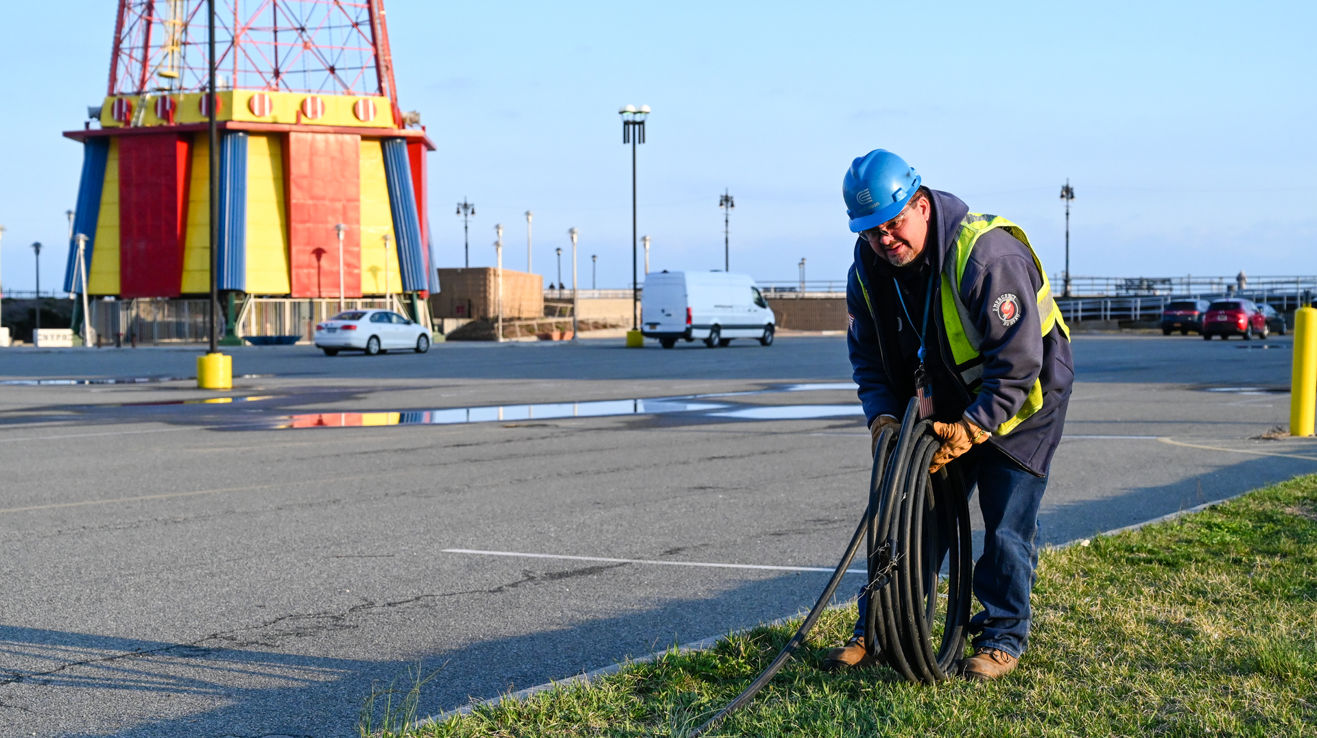 Con Edison&rsquo;s emergency operations supervisor Al Marchione rolling out the cable that will be installed to feed the temporary shed to power Coney Island Hospital MCU Park Brooklyn