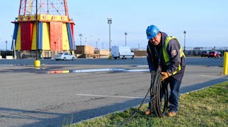 Con Edison&rsquo;s emergency operations supervisor Al Marchione rolling out the cable that will be installed to feed the temporary shed to power Coney Island Hospital MCU Park Brooklyn