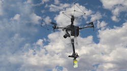 Close-up of UAS in flight with line marker. Close-up of UAS in flight with line marker.