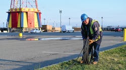 Con Edison&apos;s emergency operations supervisor Al Marchione rolling out the cable that will be installed to feed the temporary shed to power Coney Island Hospital MCU Park Brooklyn.