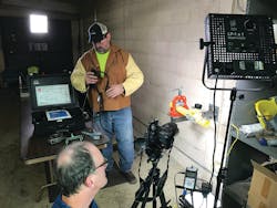 Videographer prepares to film worker demonstrating a pipe fitting fusion procedure for video to be used in apprenticeship training eBook. Videographer prepares to film worker demonstrating a pipe fitting fusion procedure for video to be used in apprenticeship training eBook.