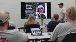 A gas trainer walks new apprentices through the eBook training materials delivered on the tablet. A gas trainer walks new apprentices through the eBook training materials delivered on the tablet.
