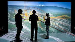 NREL scientists Evan Rosenlieb, Nicholas Brunhart-Lupo, and Amy Schwab look at a 3D visualization of a resiliency study for Tyndall Air Force Base. NREL scientists Evan Rosenlieb, Nicholas Brunhart-Lupo, and Amy Schwab look at a 3D visualization of a resiliency study for Tyndall Air Force Base.