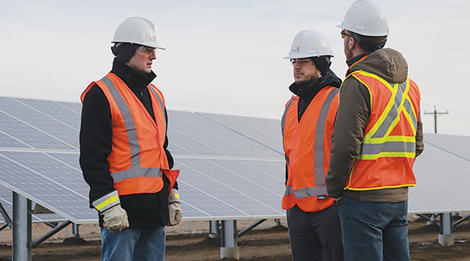 FortisAlberta field crew connects 15-MW solar farm outside Calgary, Alberta.