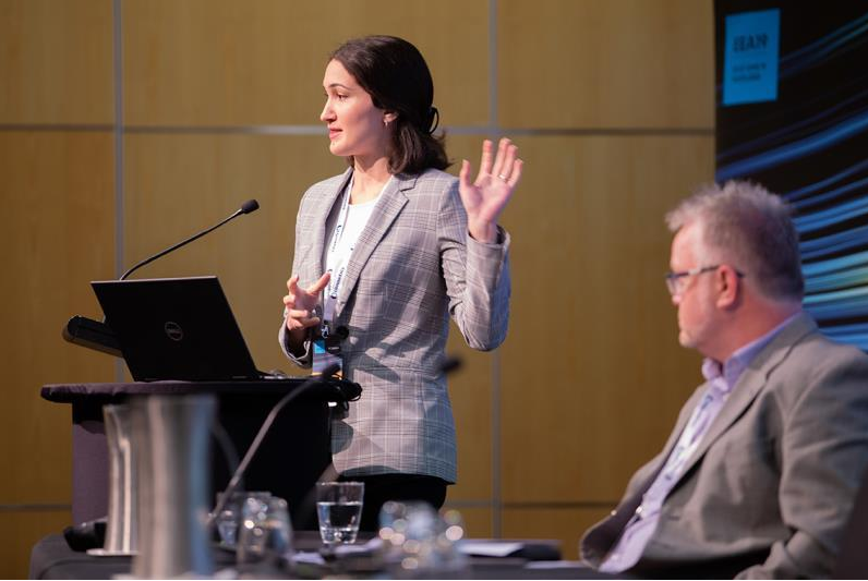Elaine Meshki speaks at an event
