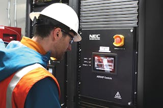 Key Capture Energy employee, Jim Brown, inspecting the controls software inside of the KCE NY 1 battery storage project.