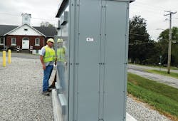 David Walster, distribution automation technician for Ameren Illinois, inspects the metering installation of the Thebes battery project. The metering is located on the side of the cabinet with a cell modem to provide the 480-V metering to ADMS. David Walster, distribution automation technician for Ameren Illinois, inspects the metering installation of the Thebes battery project. The metering is located on the side of the cabinet with a cell modem to provide the 480-V metering to ADMS.