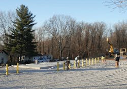 During the site preparation, crews set concrete-filled yellow barriers around the foundation of the SMS, transformer, and breaker/meter cabinet. During the site preparation, crews set concrete-filled yellow barriers around the foundation of the SMS, transformer, and breaker/meter cabinet.