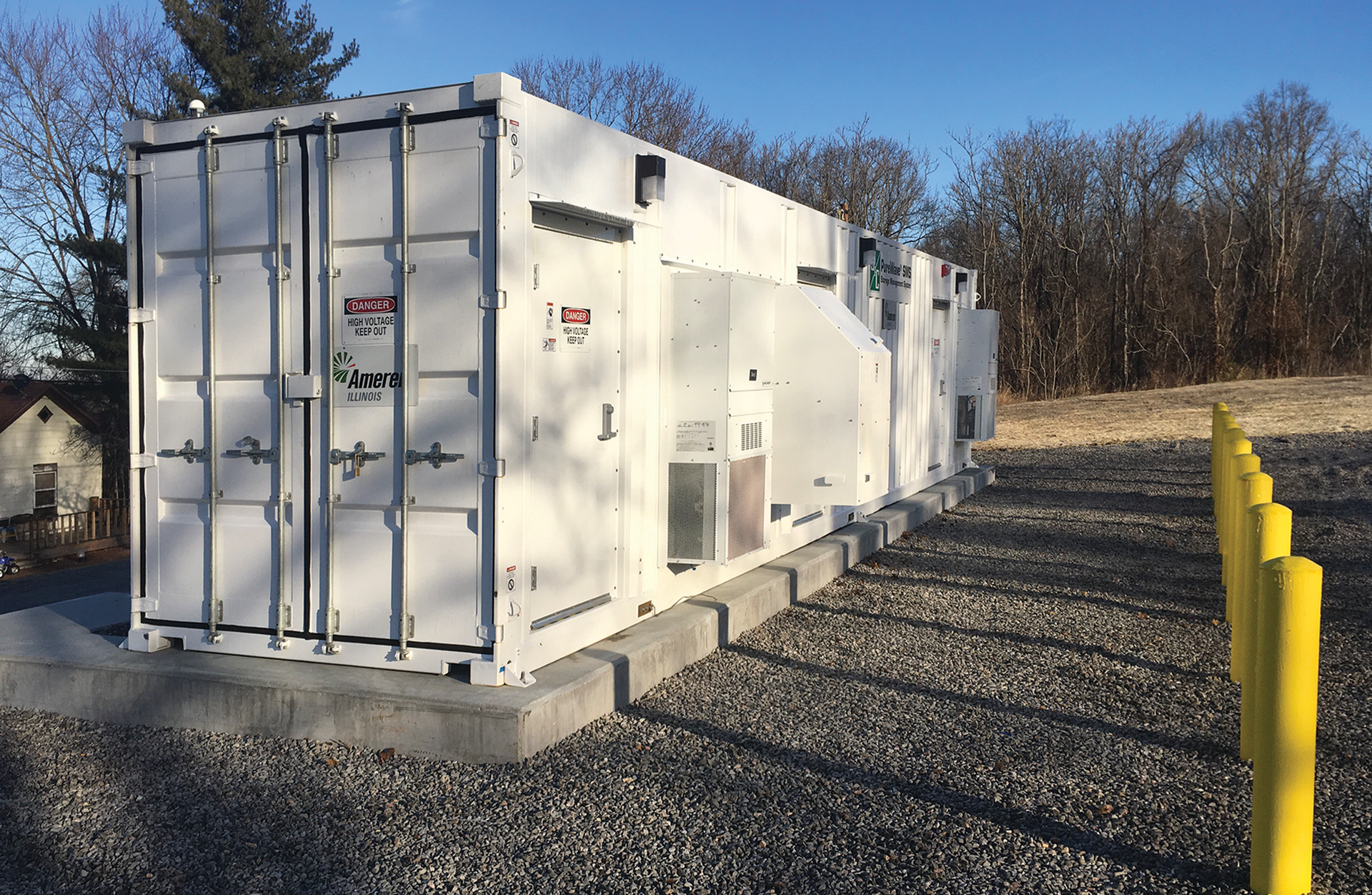 The SMS, which features batteries and equipment inside the enclosure, has been set on the foundation.