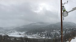 Rocky Mountain Power linemen install a weather station in a high fire-risk area in Park City, Utah. Rocky Mountain Power linemen install a weather station in a high fire-risk area in Park City, Utah.