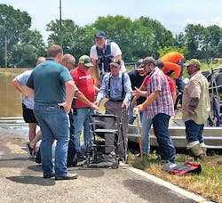 Entergy's employees assisted a customer using an airboat following a flood. Entergy's employees assisted a customer using an airboat following a flood.