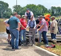 Entergy's employees assisted a customer using an airboat following a flood. Entergy's employees assisted a customer using an airboat following a flood.