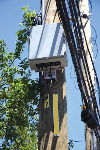 A MicroPMU cabinet awaits a final fiber-optic connection to complete commissioning.