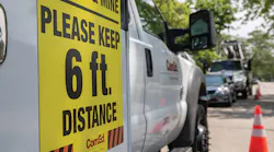 ComEd trucks post messages to maintain distance when crews respond to outages.
