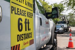 ComEd trucks post messages to maintain distance when crews respond to outages.