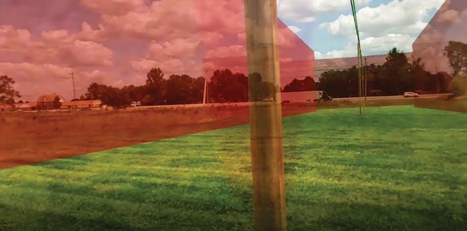 An AEP pole and line design and rights-of-way visualized in 3D augmented reality. The AEP rights-of-way are depicted in the visualization as the transparent red walls.