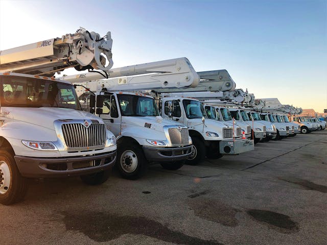 Trucks at sunrise: Crews from across the country and Canada arrived to help in the restoration.