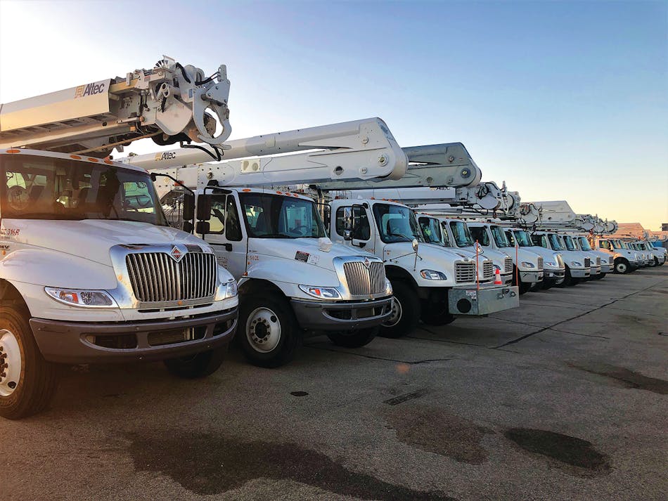 Trucks at sunrise: Crews from across the country and Canada arrived to help in the restoration.