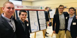 Fig. 7: WPI students presenting a CMS poster at Undergraduate Research Conference 2019, Worcester Polytechnic Institute. (Starting from left) Matthew Scherrer, Barry Aslanian, Markus Zimmerman, and Christian Curll.