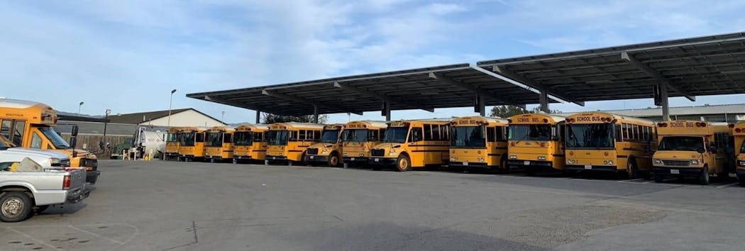 Canopies shade some of the district&apos;s school bus fleet from the sun while generating clean, renewable solar power.
