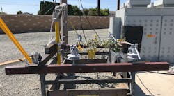 Phase-to-phase contact with vegetation on covered conductor, energized at 12 kV. Current was measured at 0.001 mA. Phase-to-phase contact with vegetation on covered conductor, energized at 12 kV. Current was measured at 0.001 mA.