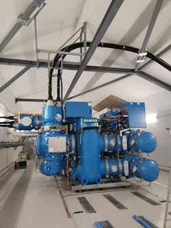 Blue GIS installed in switch room. Incoming cable is over blue GIS and transformer cables exit switch room through wall on left. Blue GIS installed in switch room. Incoming cable is over blue GIS and transformer cables exit switch room through wall on left.