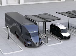 An electric truck and delivery van recharge at a solar powered facility in this rendered illustration.