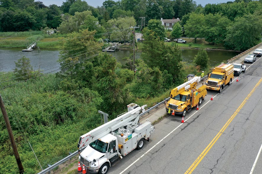 Eversource line crews work to make repairs on Aug. 7 following Isaias in Old Lyme, Connecticut.