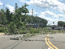 Downed tree branches, electric lines and equipment are scattered across Route 10 in Southington, Connecticut, on Aug. 5.