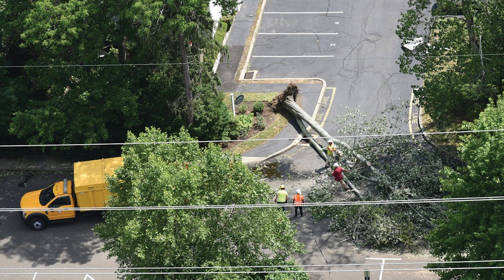 Crews respond to a downed tree near the Clock Hill Condos in Darien, Connecticut, on Aug. 10.