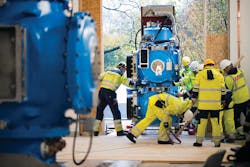 Team moves blue GIS from platform erected outside substation into building. Team moves blue GIS from platform erected outside substation into building.