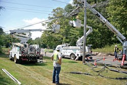 Eversource line crews work to make repairs following Isaias on Aug. 8 near Route 80 East in Madison, Connecticut.