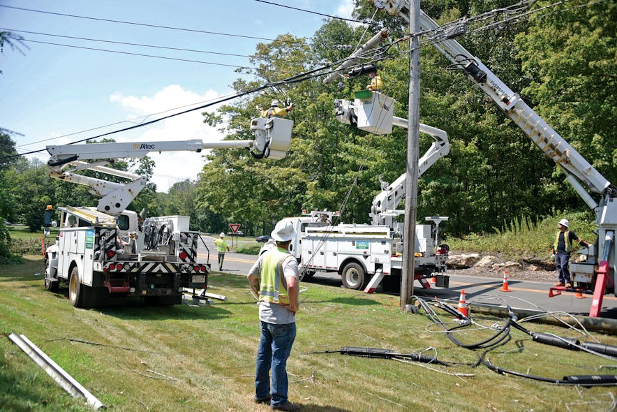 Eversource line crews work to make repairs following Isaias on Aug. 8 near Route 80 East in Madison, Connecticut.