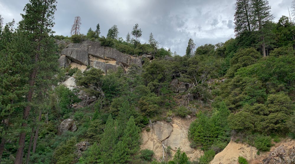 This rockfall hazard right above an access road presents both direct and indirect potential liability. An access road blocked by large boulders could inhibit inspections and interfere with emergency response.