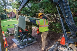 Contractors guide transformer into position. Contractors guide transformer into position.