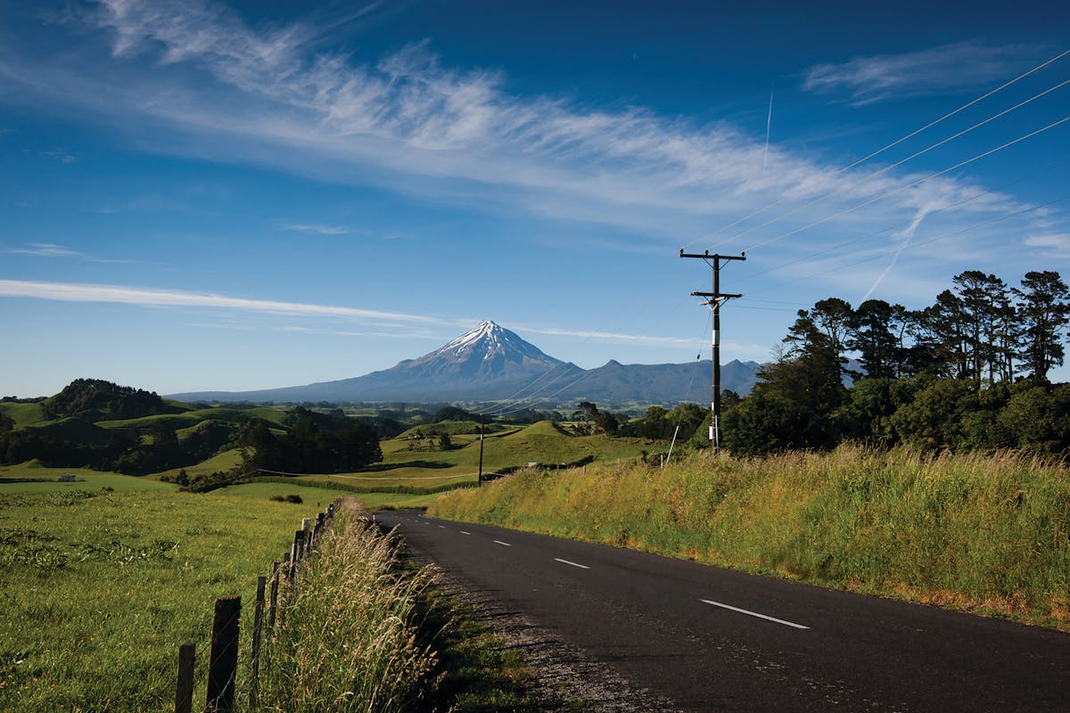 Networks in remote rural regions of New Zealand are aging and require renewal investment to provide safe and reliable service. Powerco&rsquo;s distribution network is predominantly an overhead line network constructed with concrete poles, timber cross arms and porcelain insulators using a wide variety of conductor types. (Taranaki regional landscape with mountain).